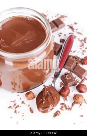 Sweet chocolate cream in jar isolated on white Stock Photo