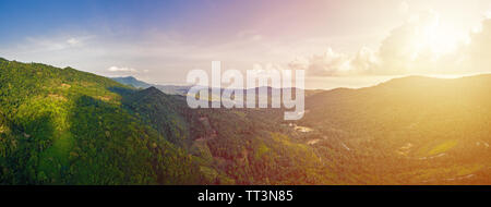 Aerial view of scenic sunset over jungle mountains at Ko Samui island, Thailand Stock Photo