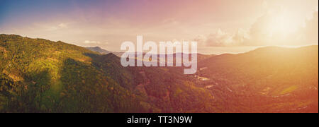 Aerial view of scenic sunset over jungle mountains at Ko Samui island, Thailand Stock Photo