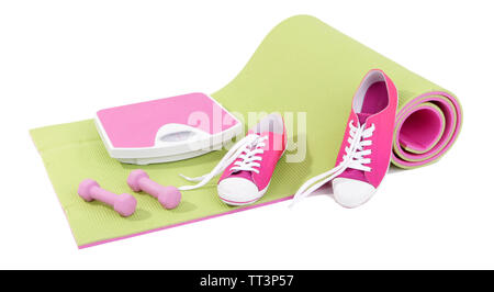 Everything for sport trainings on a carpet on white background isolated Stock Photo