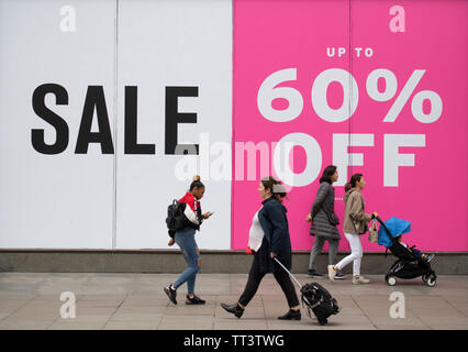 Oxford Street, London, UK. 14th June 2019. Arcadia Group’s Topshop flagship store at Oxford Circus in London’s West End offers up to 60% off clothing lines. The troubled group intends closing 48 stores nationwide as part of a restructuring plan. Credit: Malcolm Park/Alamy Live News. Stock Photo