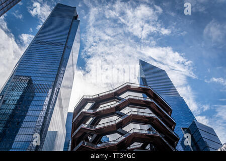Contemporary architectural office buildings and the Vessel in Hudson Yards, the district of New York where a lot a new buildings are being built. New Stock Photo