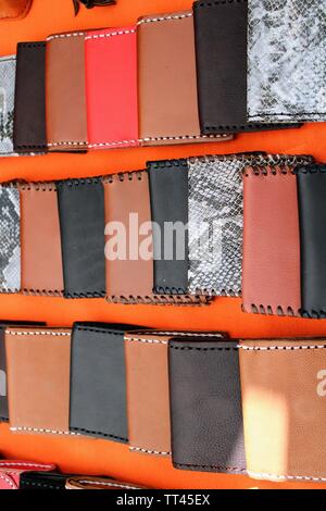 Leather wallets in different shades of brown and black , for men Stock Photo
