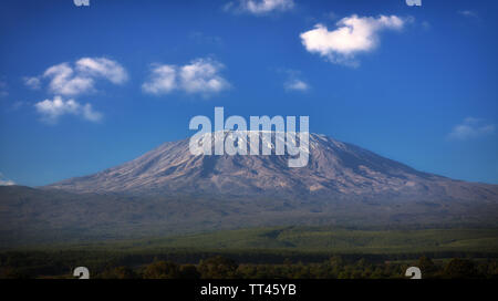 Mount Kilimanjaro with blue sky and clouds, Tanzania Stock Photo