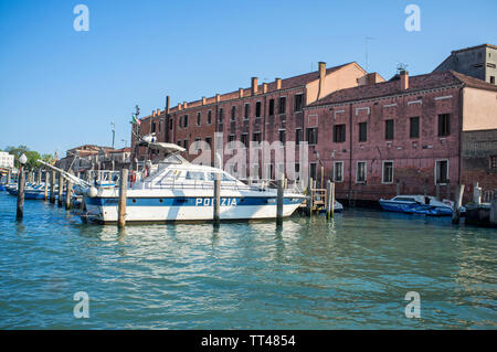 10 may 2019, Venice, Italy - Venice Police Headquarters (Questura di Venezia), seen from the sea, with the boats docked at the pier Stock Photo