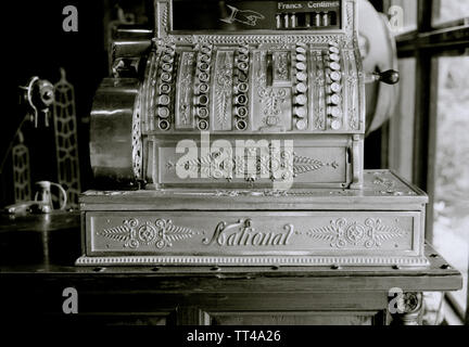 Old fashioned cash machine in a flea market in Bangkok in Thailand in Southeast Asia Far East. Cash Register Stock Photo