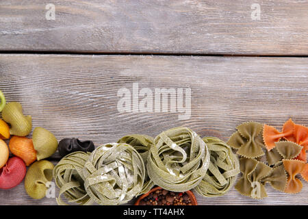 Colorful pasta on wooden background Stock Photo