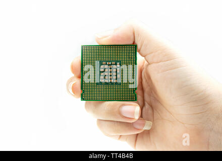 Realistic CPU back view processor chip in hand Stock Photo