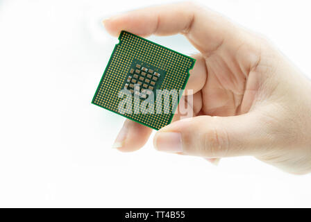 Realistic CPU back view processor chip in hand Stock Photo