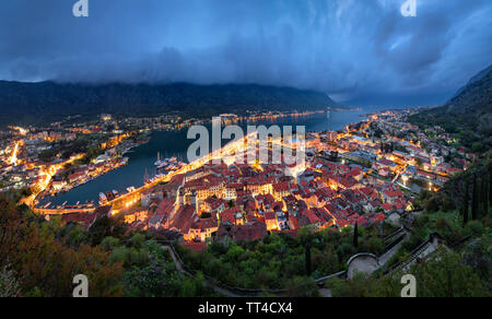 Panorama of Kotor old town and Kotor Bay at dusk, Montenegro Stock Photo
