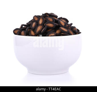 watermelon seeds in bowl isolated on white background Stock Photo