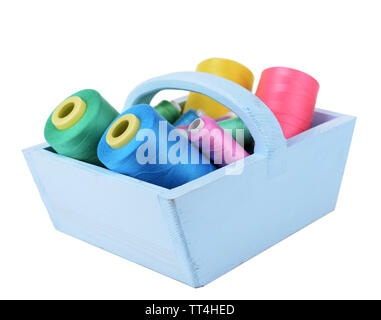 Colorful skeins of thread in wooden box isolated on white Stock Photo