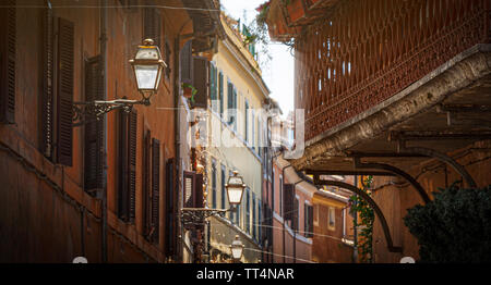 glimpse of an alley of Trastevere in Rome with ancient buildings. concept of travel and tourist destinations Stock Photo