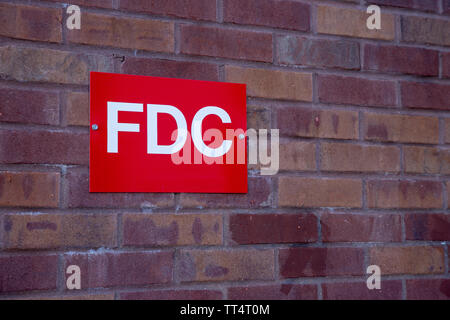 Fire Department Connection Sign on brick wall of building Stock Photo