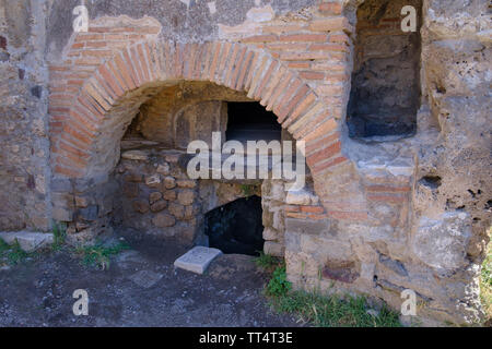 Oven in a bakery among archaeological excavations of the ancient Roman town of Pompeii in Campania near Naples in Southern Italy Stock Photo