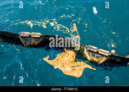 Sea pollution, waste oil on the sea, pontoon sea barrier Stock Photo