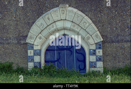 Close up of blue door with archway surround Stock Photo