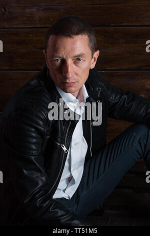 portrait of a very beautiful old serious man, dark hair, posing in classic suit on white background Stock Photo