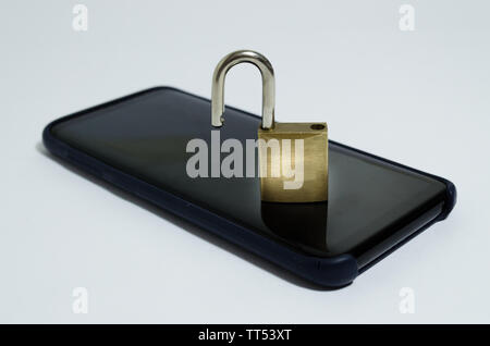 Conceptual photo security on mobile phones. A open padlock on a cell phone on a white background Stock Photo