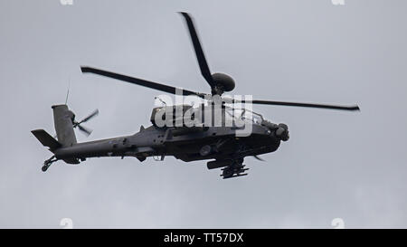 AgustaWestland Apache AH Mk1 in flight at Duxford Aerodrome, Cambridgeshire Stock Photo