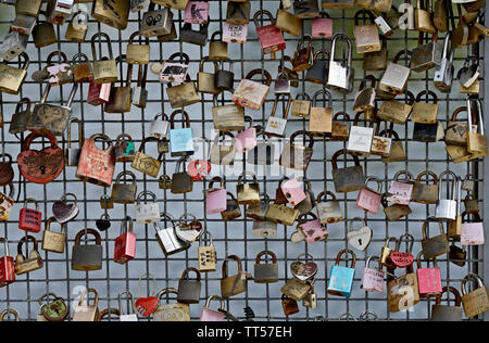 Love locks on a fence of a bridge Stock Photo