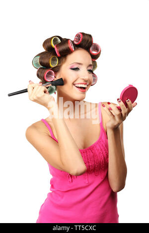 Beautiful girl in hair curlers isolated on white Stock Photo