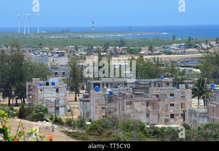 Derelict buildings and concrete apartment blocks in Gibara, Southern Cuba Stock Photo