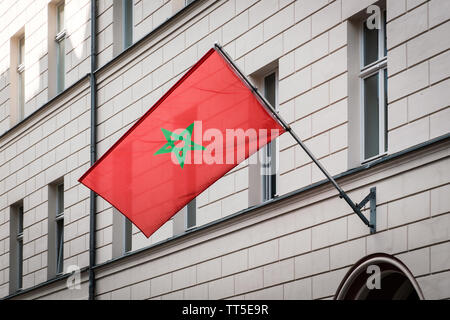 morocco flag - moroccan flag on pole on building - Stock Photo