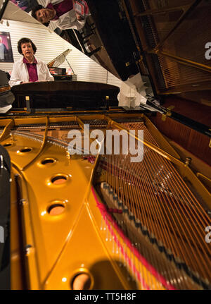 UNITED STATES - May 2, 2016: The Piano Company has opened at 206 E Market St. Owner Antoinette Pardon poses for a photo in her new store.   (Photo by Stock Photo