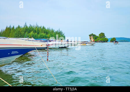 AO NANG, THAILAND - APRIL 27, 2019: The line of speed-boats, moored at the Noppharat Thara pier, located at the estuary of Klong Son, flowing to the A Stock Photo