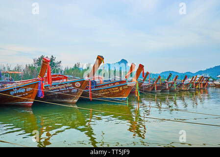 AO NANG, THAILAND - APRIL 27, 2019: The line of longtail boats are moored along the bank of Klong Son canal in Noppharat Thara National Park, on April Stock Photo