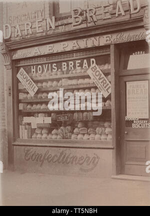 Vintage Photographic Postcard Showing The Shopfront of A.E.Paine. A Baker and Pastry Cook. Signs For Daren Bread, Hovis Bread, Bovril, Paine's Bread and Robbs Nursery Biscuits. Stock Photo