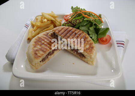 flat bread baked on a griddle toast turkish style street food cuisine with side dishes Stock Photo