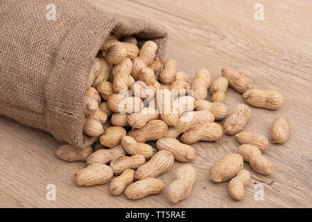 Poured raw peanuts close up photo Stock Photo