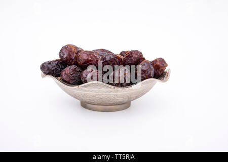 Close up macro photo of dates fruit, date fruits on isolated white Stock Photo