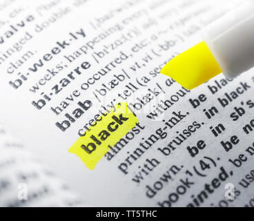 Yellow marker highlighting word in dictionary Stock Photo