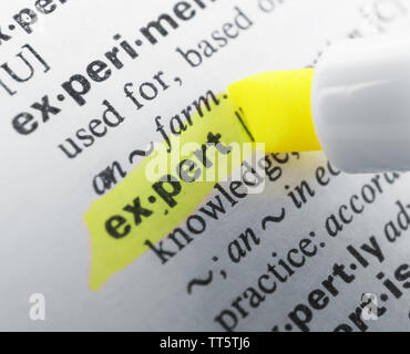 Yellow marker highlighting word in dictionary Stock Photo