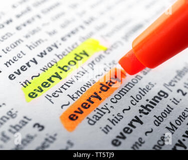 Orange marker highlighting word in dictionary Stock Photo