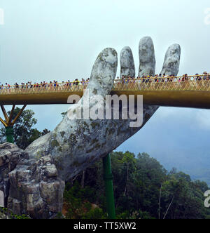 Ba Na, Vietnam - June 06, 2019; The Golden Hand Bridge at Ba Na in the central highlands of Vietnam. Stock Photo