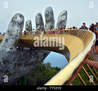 Ba Na, Vietnam - June 06, 2019; The Golden Hand Bridge at Ba Na in the central highlands of Vietnam. Stock Photo