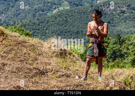 San Andres Semetabaj, Lake Atitlan, Guatemala - November 10, 2018:  Maya man plays pipes before Maya ballgame starts at Lake Atitlan. Stock Photo
