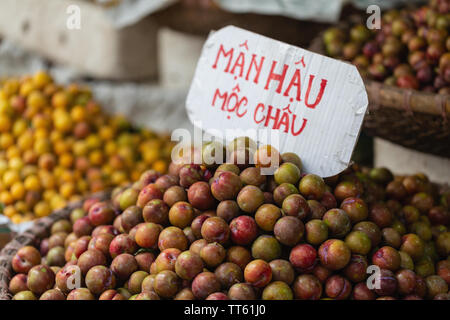 Plums for sale at local market, Hanoi, Vietnam, Asia Stock Photo