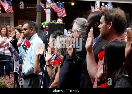 Philadelphia, PA, USA - June 14, 2019: Thirteen immigrants officially become new U.S. citizens in a special naturalization ceremony on Flag Day. Stock Photo