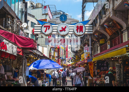 Tokyo, Japan - June 13, 2019: Ameya Yokocho, or Ameyoko, is a famous shopping arcade filled with around 400 shops. the street was the site of a black Stock Photo