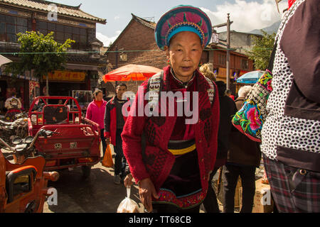 01 Feb 2017- Dali, China- Local minority woman in front of market Stock Photo
