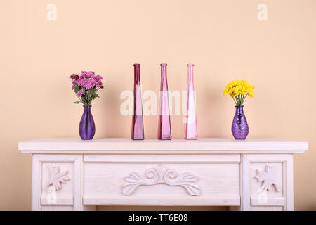 Fireplace with beautiful purple decorations in room Stock Photo