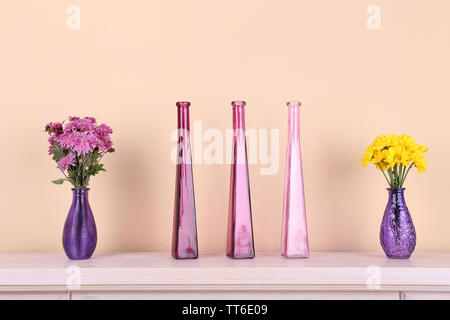 Fireplace with beautiful purple decorations in room Stock Photo