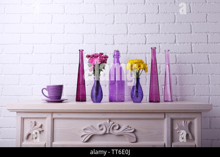 Fireplace with beautiful purple decorations in room Stock Photo