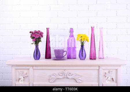 Fireplace with beautiful purple decorations in room Stock Photo