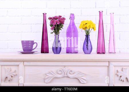 Fireplace with beautiful purple decorations in room Stock Photo